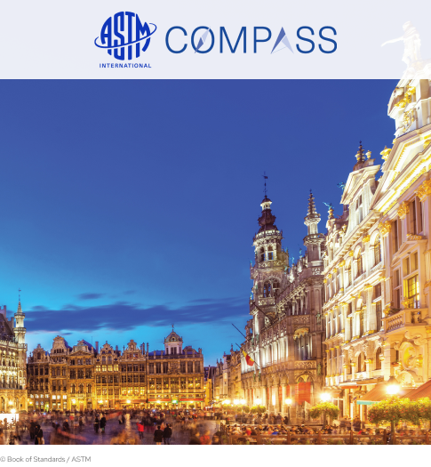 ASTM Compass cover picture, with the logo above on a white background. The picture depicts the city of Brussels at sundown.