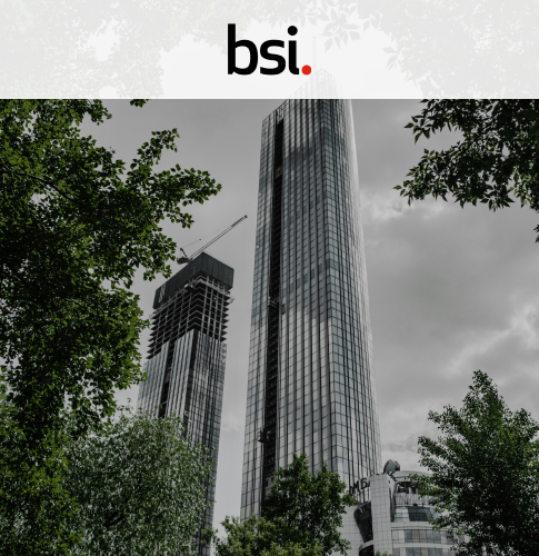 bsi cover picture showing a skyscraper with trees surrounding it. Up top is the BSI logo on a white rectangle
