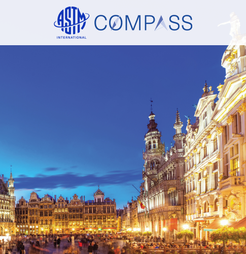 ASTM Compass cover picture, with the logo above on a white background. The picture depicts the city of Brussels at sundown.
